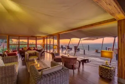 Open-sided tent lounge at Loisaba Tented Camp looking out over the conservancy