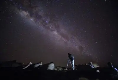Milky Way arcing above telescopes at a private astronomy session