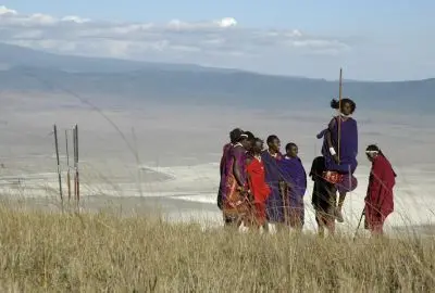 Maasai men in red shukas looking out across the Ngorongoro caldera