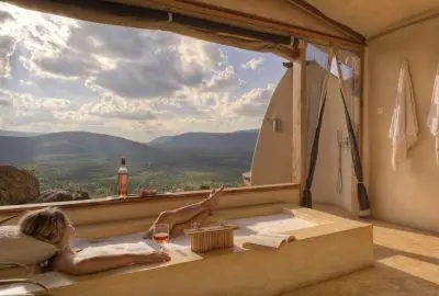 Open-fronted suite with a daybed looking out across the hills
