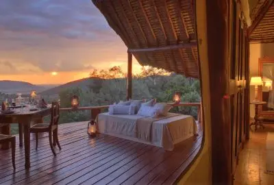 Lounge deck of a Mara suite overlooking the plains at sunset