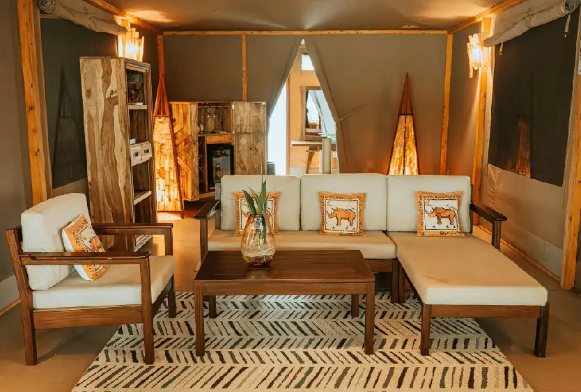 Lounge corner of a tented suite with beaded cushions at Soroi Luxury Migration Camp
